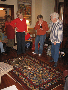 Pat Mensing showing off her rug to the studio class