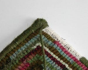 Whip finish on a hooked rug
