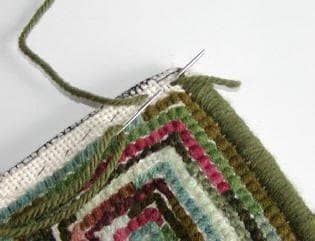 The first step in whipping the edge on a hooked rug