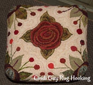 Rug hooking footstool by hooked by Suz White
