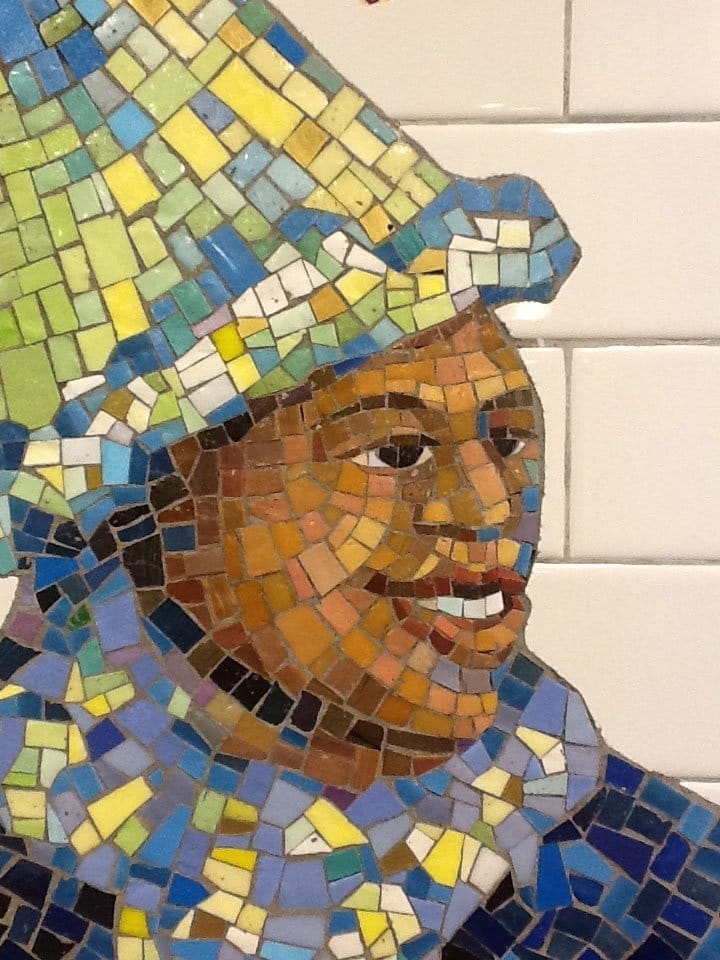 Tile art NYC subway smiling man